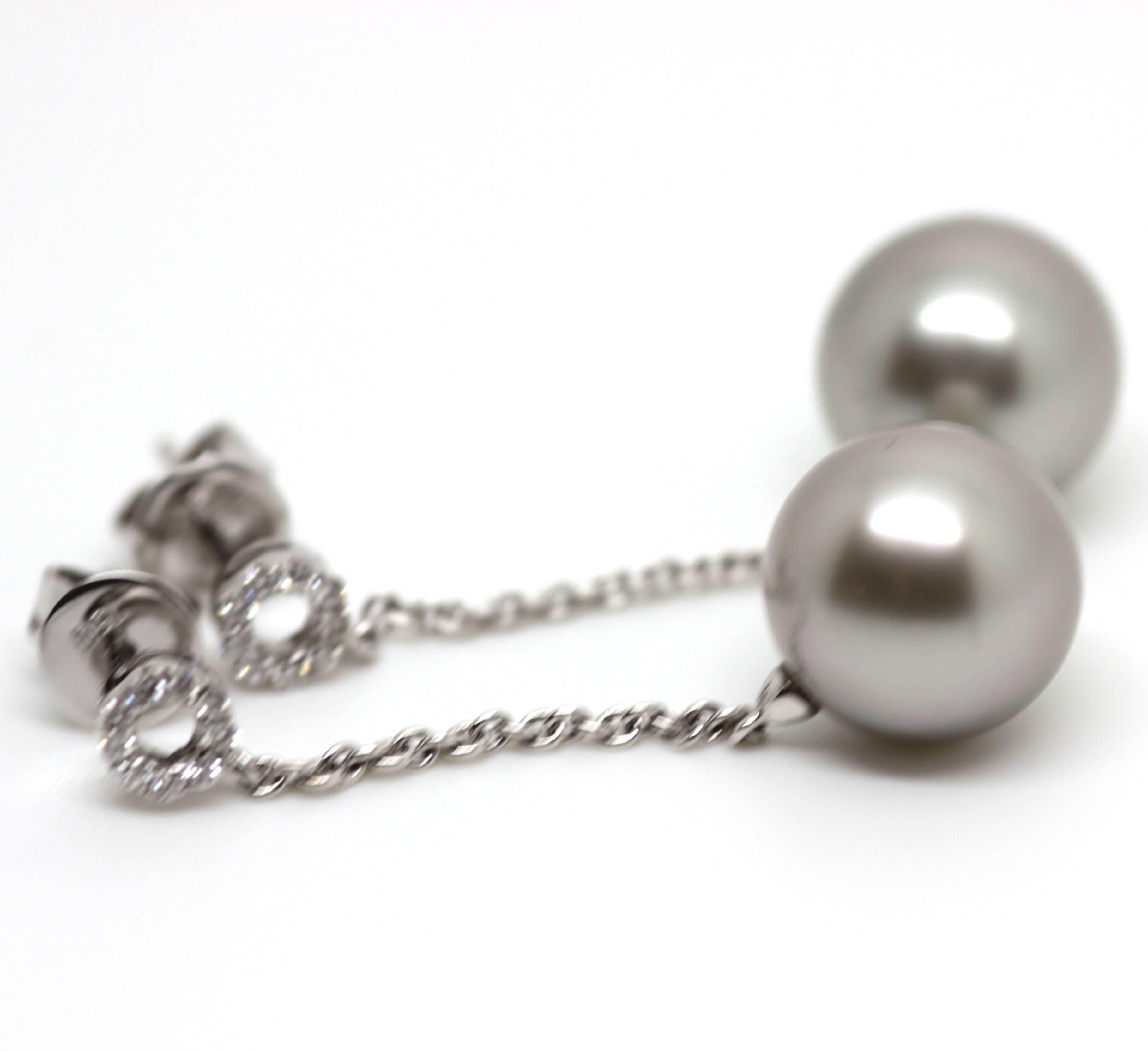 Tahitian grey pearl dangling earrings set in 18ct white gold with a diamond circular top. Circa: New
