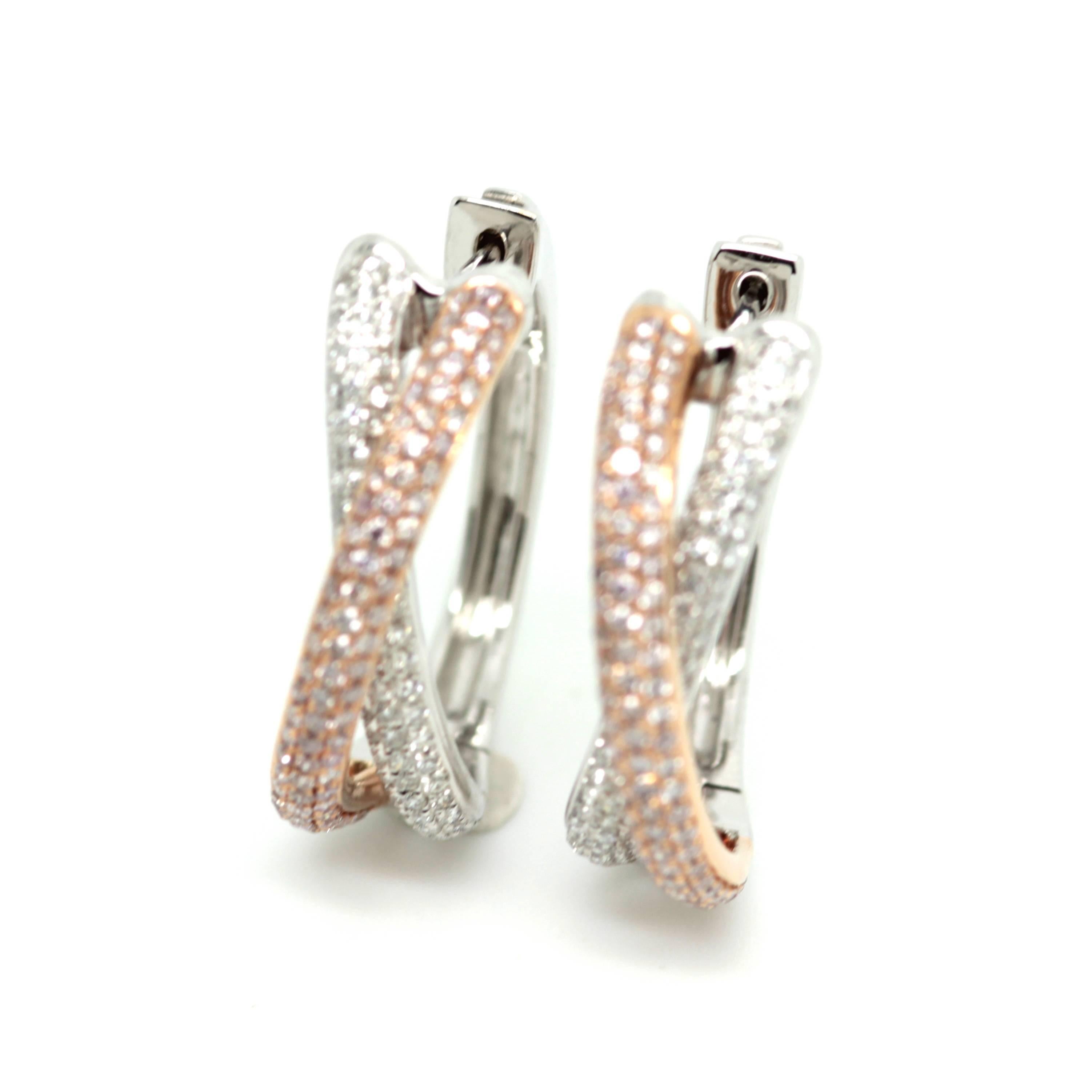 Natural  1.13ct fancy pink and white diamond hoop stud earrings set in 18k white and rose gold.  
