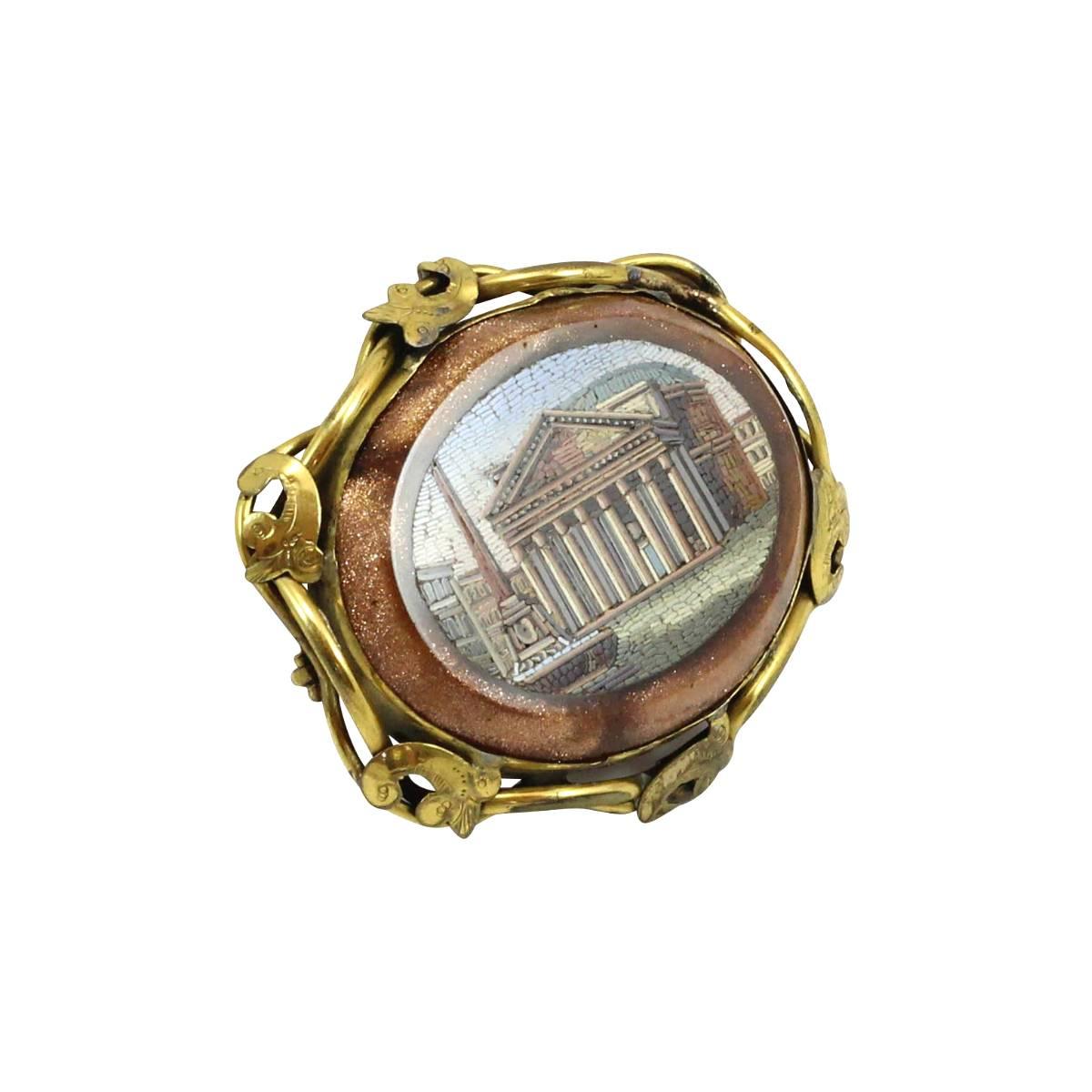 A 19th century Italian micromosaic brooch depicting the Pantheon in Rome. The mosaic is set in goldstone (also known as adventurine glass), of which the process of creation was attributed to the Miotti family in 17th century Venice. A specialty of