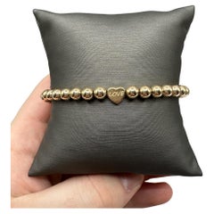 Love Engraved Bead Bracelet in 14kt Yellow Gold - 5mm Beads, 7", 2.3g, New