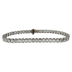 Bracciale tennis con diamanti taglio smeraldo in oro bianco 14K 6,10ct FG VS