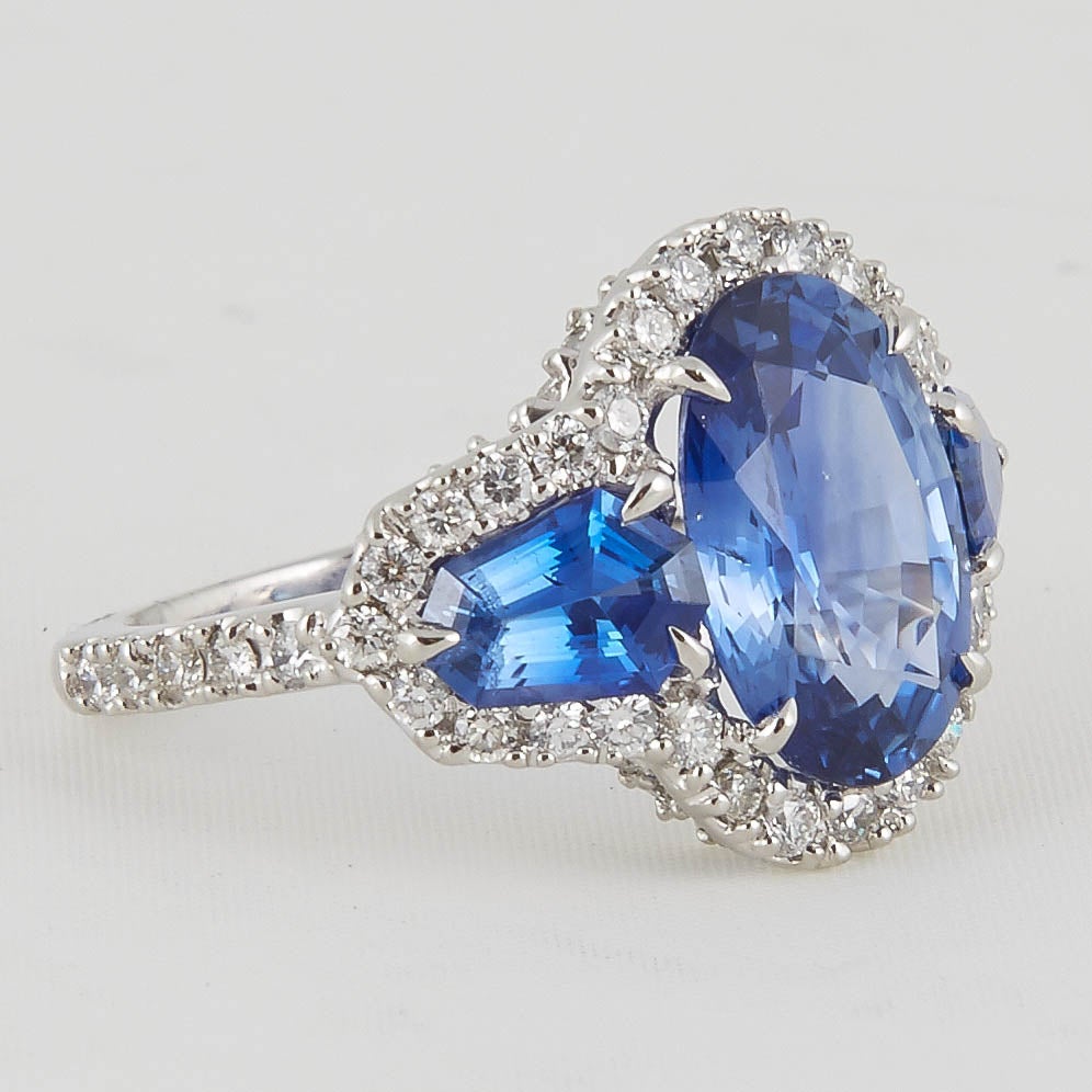 Oval Cut Unique 6.50 Carat Sapphire and Diamond Ring For Sale