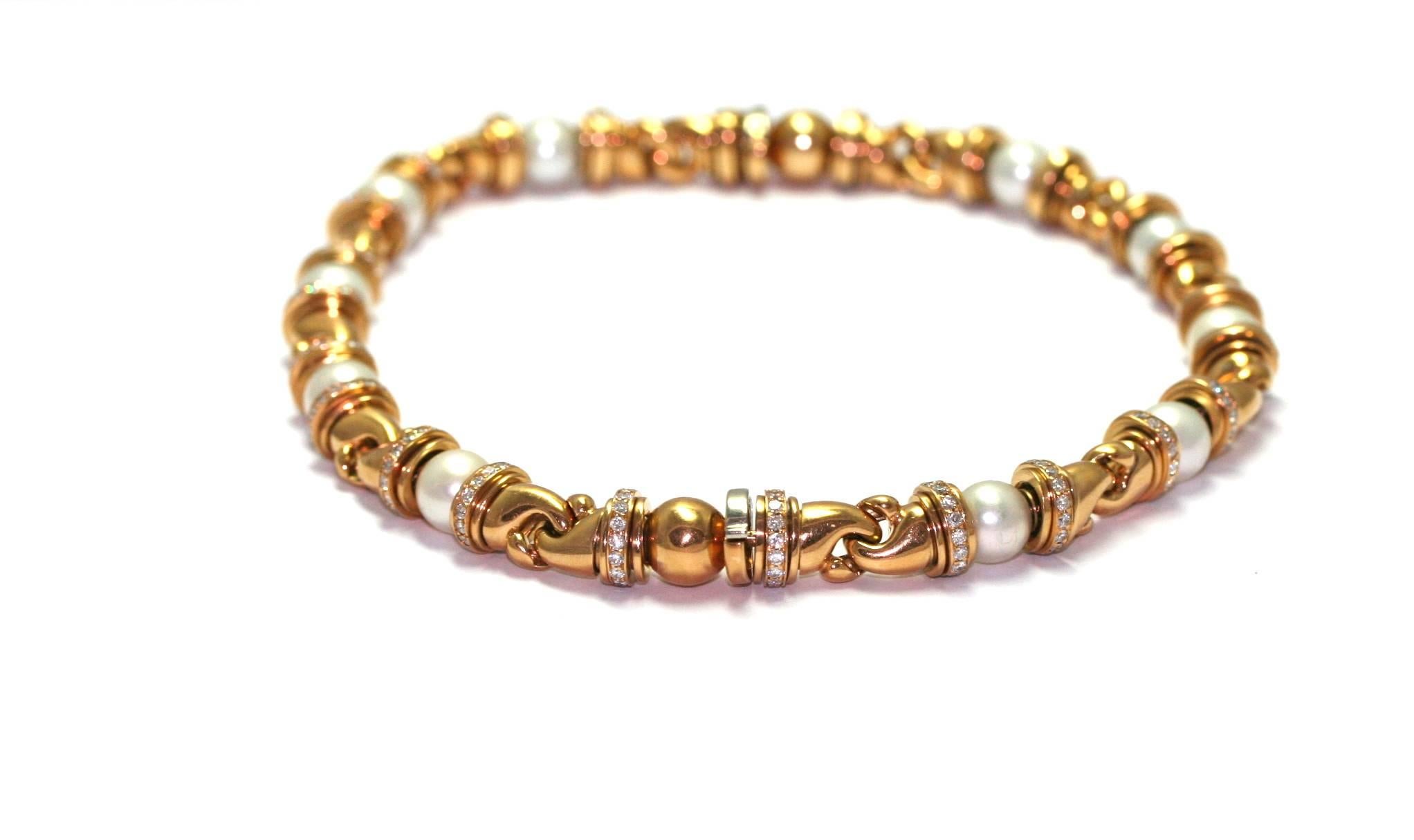 BVLGARI "Gancio" 2 bracelets convertible in necklace, yellow gold, set with diamonds and 5 pearls each, signed
