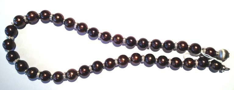 Necklace of 35 Tahitian Chocoloate color pearls, alternated with white gold paved with diamonds beads and small white gold beads, round clasp in brushed white gold (120 gms)