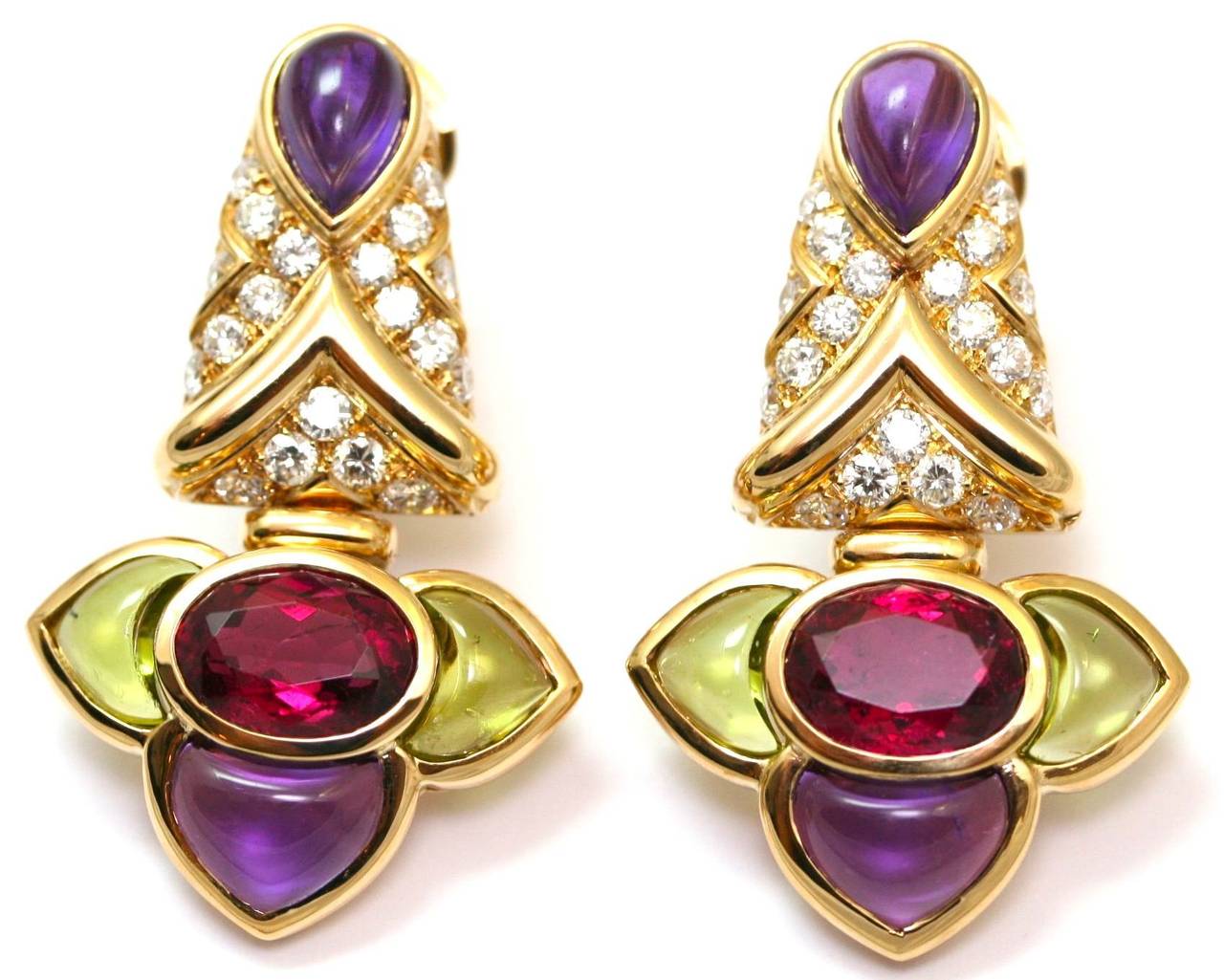 BVLGARI Earrings in yellow gold set with oval cabochon red tourmalines, amethysts, peridots and diamonds, signed and numbered 1990, 40mm (35.9 grams)