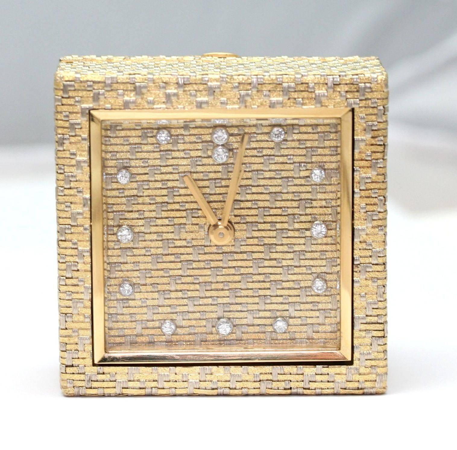 BOUCHERON Alarm clock in woven three colors gold, hours set with diamonds,  signed and numbered 70460, with Boucheron case (359.5 grams)