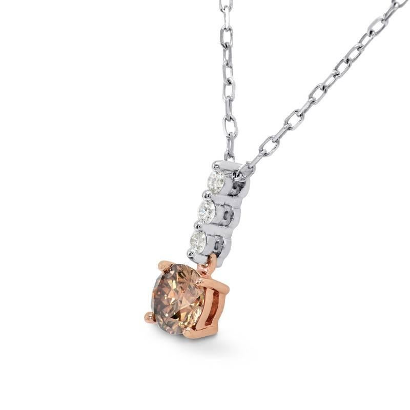 A tasteful and classic fancy deep brown round brilliant diamond drop pendant, mounted in 18K White and Rose Gold. The center diamond is certified by IGI as a 0.48 carat round brilliant cut natural fancy deep brown diamond.  
The additional three