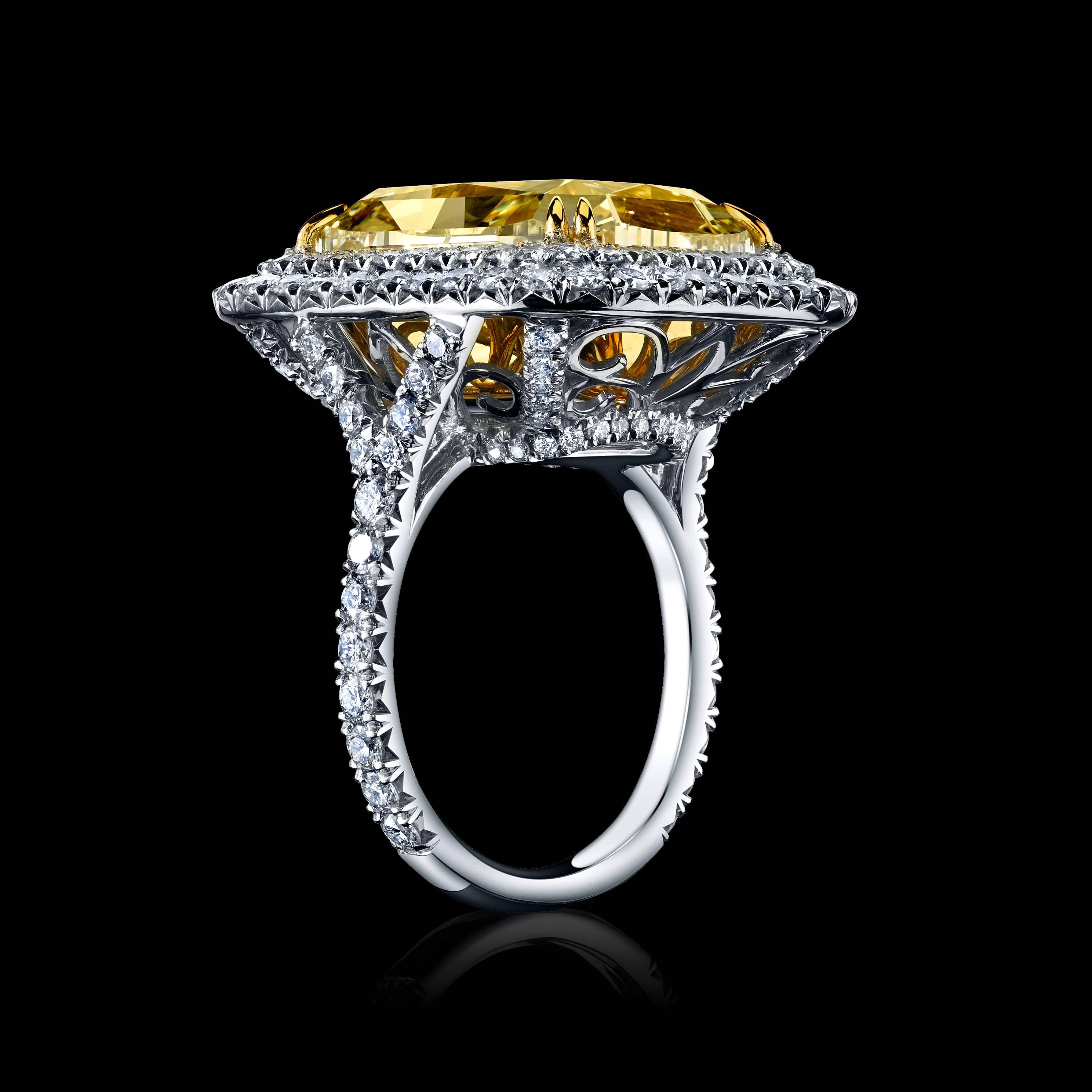 A unique and rare 17.49ct Radiant Cut GIA Certified Natural Fancy Light Yellow Diamond, surrounded by a double halo of colorless collection diamonds. 

Set in Platinum & 14K Yellow Gold. 

Ring is currently a size 6.5