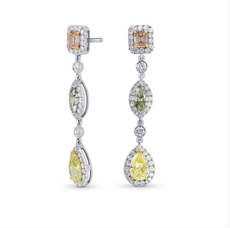 Couture diamond drop earrings set with natural 0.81Ct TW Fancy Orangy Pink Emerald cut diamonds, 0.75Ct TW Fancy Light Green Marquise and 2.05Ct TW Fancy Light Yellow Pear diamonds. Mounted in 18K white, yellow and rose gold, the diamond halos and
