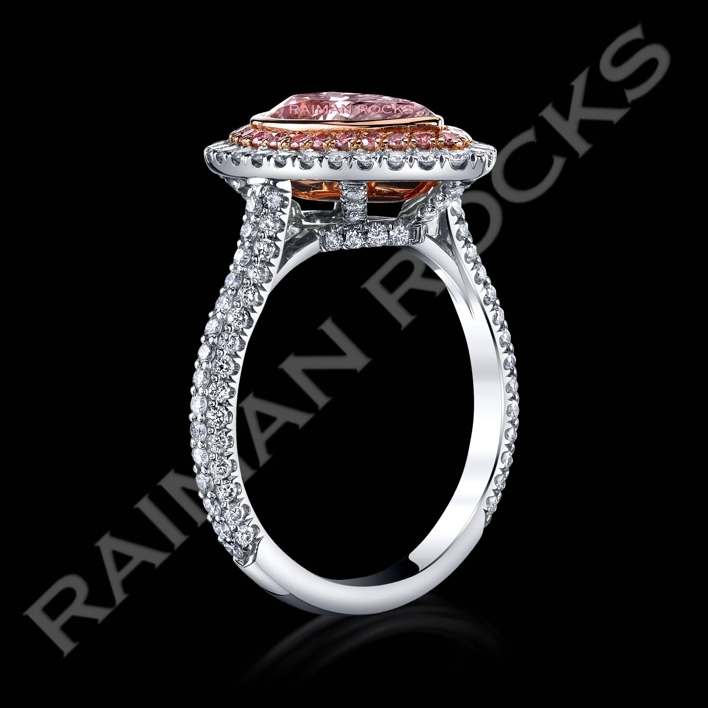 A magnificent Pink Diamond ring exhibiting a 2.18ct pear cut center Pink diamond set in a rose gold box to enhance its beauty and color. The Pink center stone is surrounded by a halo of Natural Fancy Pink diamonds melee enhancing the center stone's