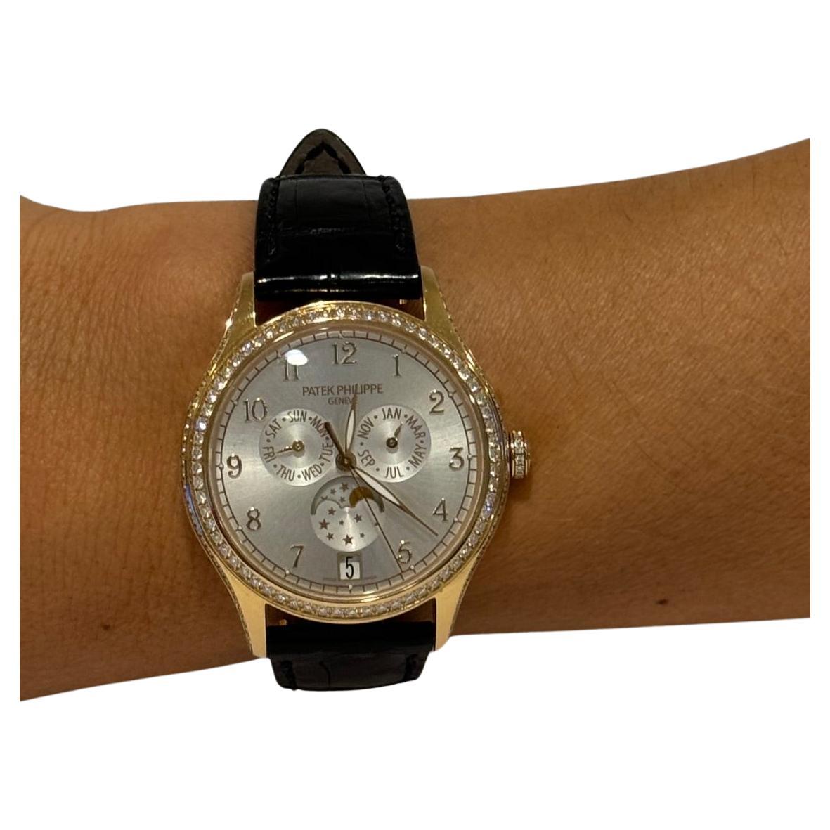 
-18ct gold old case with black alligator leather strap. 
-Fixed 18kt gold bezel set with diamonds. 
-Silvery sunburst dial with luminous gold-tone leaf-style hands and arabic numeral hour markers. 
-Minute markers around the outer rim. dial type: