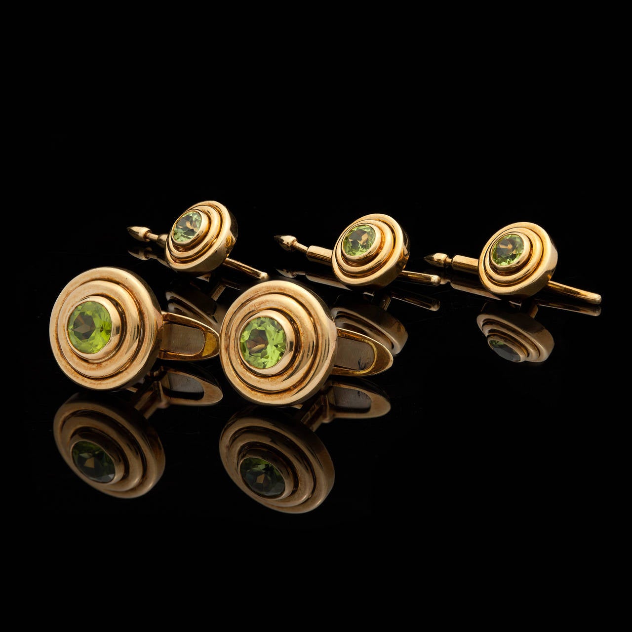 Tiffany & Co. peridot Dress Set Comprised of a encircled swivel back Pair of Cuff Links together with Three plunger style Shirt Studs Set in 18Kt Yellow Gold.