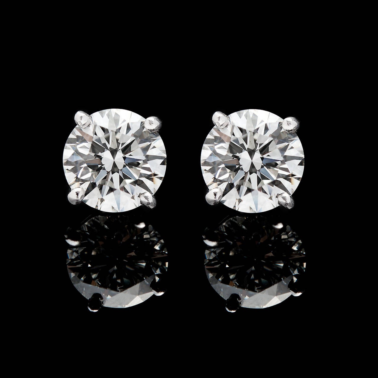 2.43 Carat Total Weight Round Brilliant Cut Diamond Studs with F & G Color and VVS2 & VS2 Clarity, Set in Platinum. The earrings measure approximately 7mm in diameter and weigh 2.6 grams combined. They come complete with GIA reports 2155284681 &