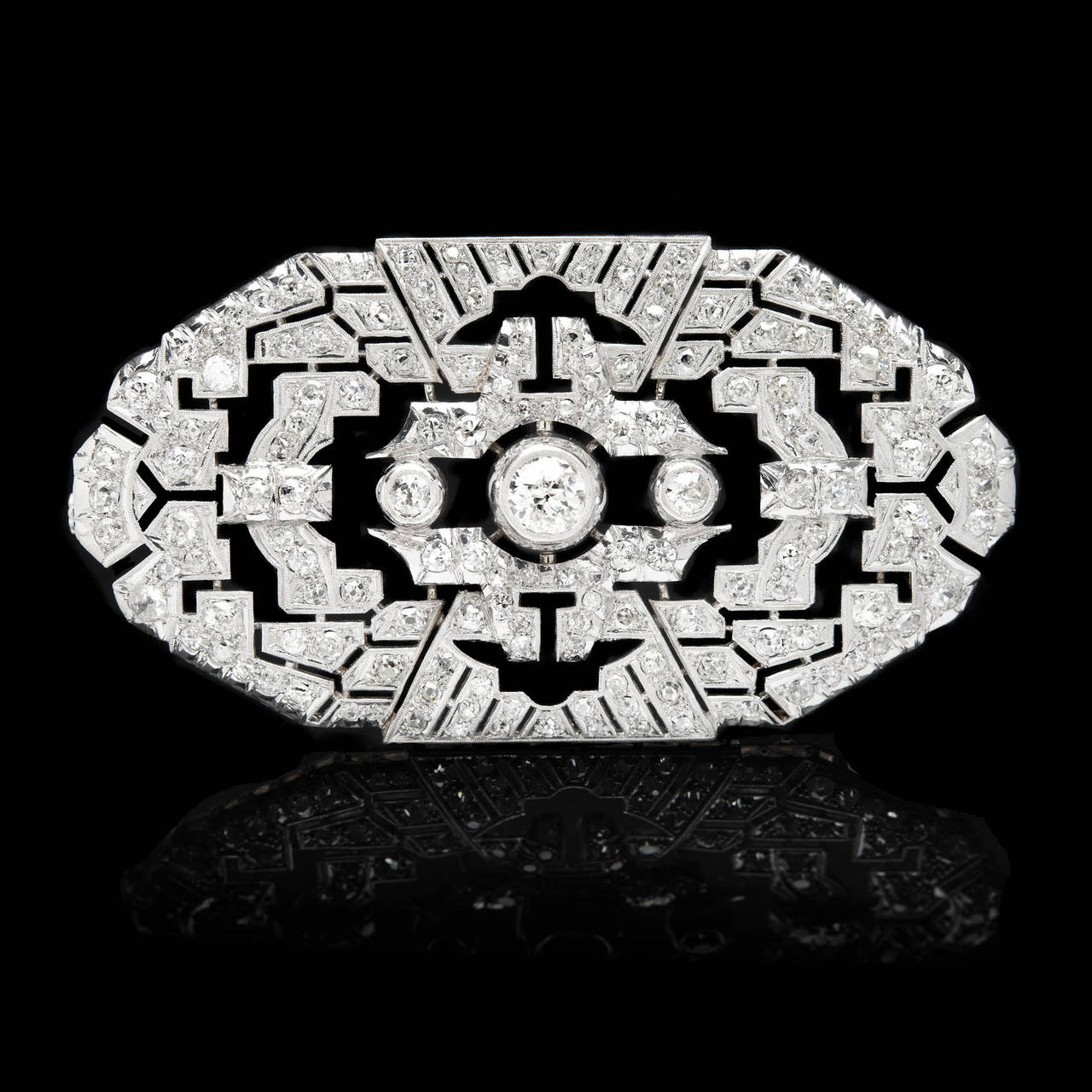 Platinum Diamond Brooch Features One Center Old Mine Cut Diamond, for approximately 1.01 Carats, in a Geometric Setting with Milgrain Detail. The additional 158 old cut diamonds total approximately 5.00 carats. The brooch is 3.25 by 1.75 inches and