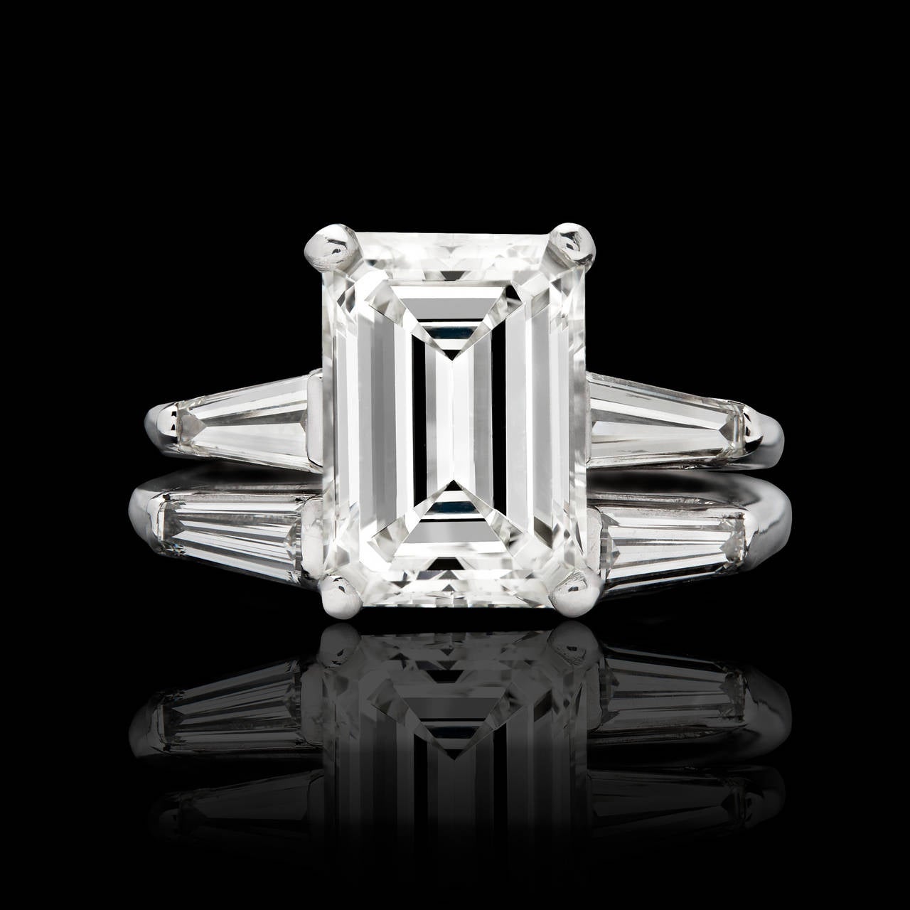 Beautiful Platinum Wedding Set Features a 3.26 Carat GIA Graded (M Color, VS2 Clarity) Emerald Cut Diamond. The center stone is enhanced by 4 elegant tapered baguette diamonds weighing approximately 0.80 carat. GIA report number 6167985359 is