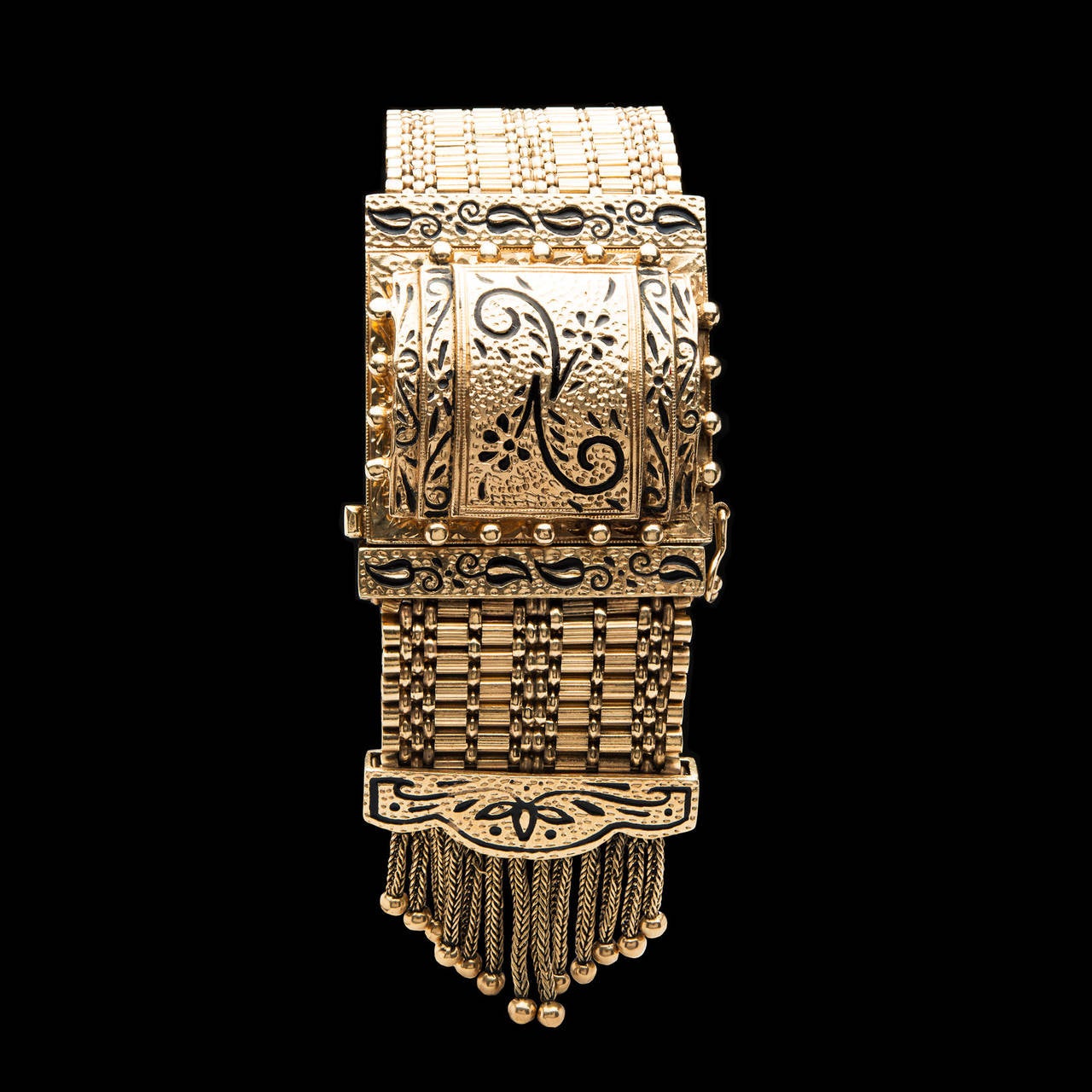Victorian Style 14Kt Yellow Gold Mesh Bracelet with Tassel Detail Features a Hidden Geneva Watch Measuring 18.5mm x 14.5mm Encased in a Decorative Covering. The bracelet is 6.75 inches long and 26mm wide, weighing 80.6 grams.