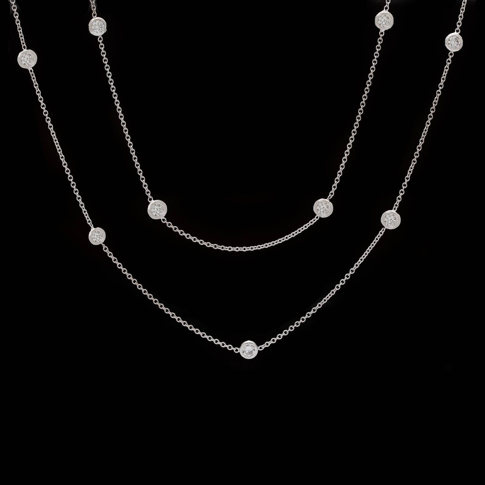 36 inch long diamond by the yard necklace in 18k white gold with 18 diamonds totaling 4.50cttw.  The round brilliant cut H-J/VS-SI diamonds are bezel set and stationed on a thin white gold chain.  This is a very versatile piece with a lot of style.