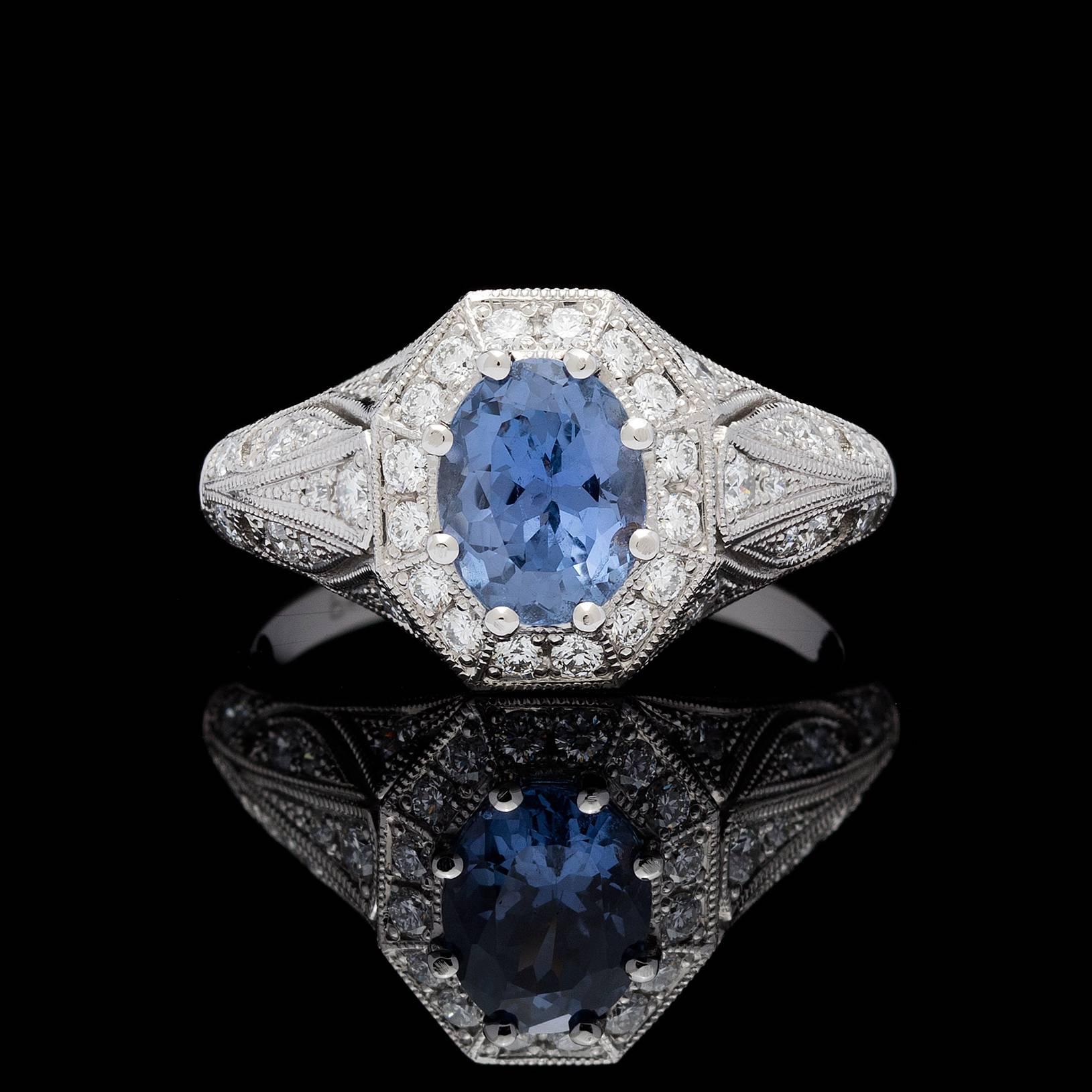 This ring features a 1.50 carats oval mixed brilliant-cut sapphire with a blue-violet to purple color-change phenomenon characteristic. The sapphire is accompanied by GIA report # 2101710491. Top face of the ring is octagonal in shape detailed with