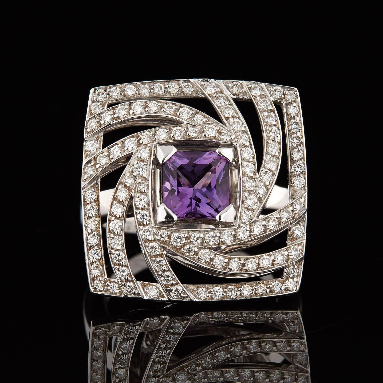 Luca Carati Italian designed 18k white gold cocktail ring features a 1.16 carat square cut amethyst centered amongst 0.80 carat total weight round brilliant cut diamonds of F-G VS quality swirling toward the center. This cocktail ring measures 22mm