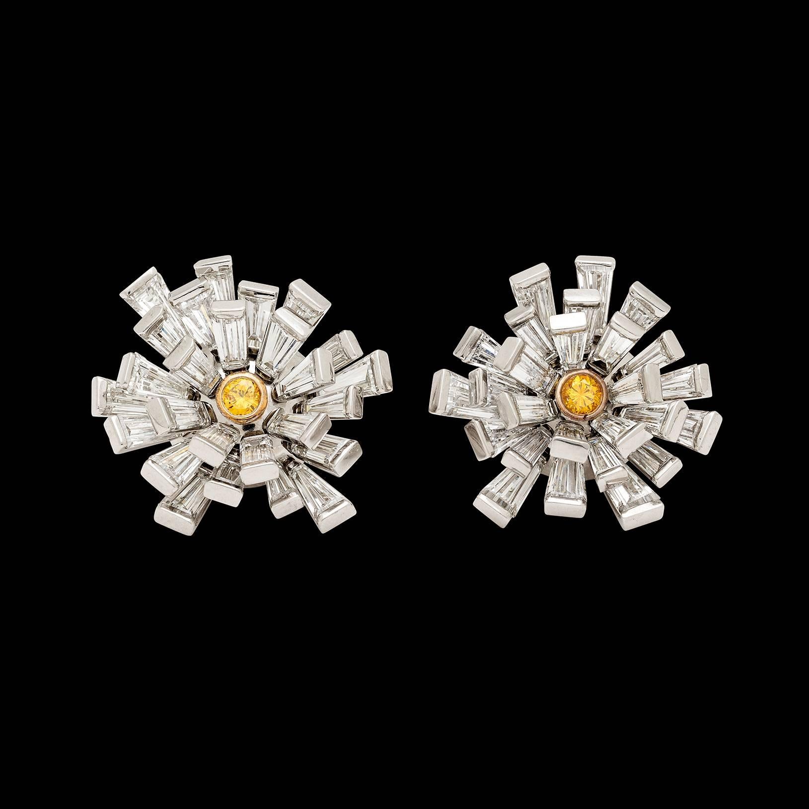 Platinum and 18k yellow gold cluster earrings designed as stylized dandelions, each center around a vivid yellow round brilliant-cut diamond, weighing a total of 0.46 carats. These rare vivid yellow stones are fully surrounded by fine white