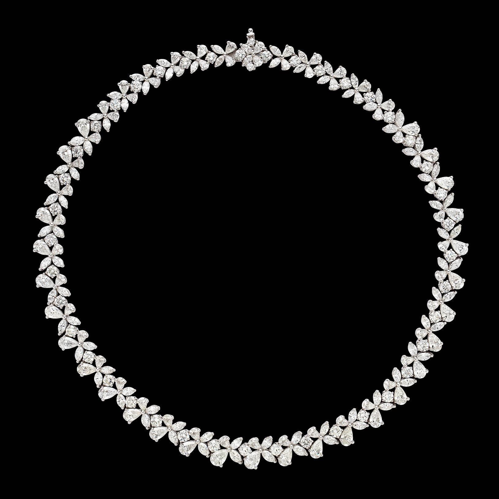Of classic elegance, the platinum necklace is designed with 205 pear, marquise and round brilliant-cut diamonds, in graduating stylized florets, weighing in total 49.08 carats. It measures 17 inches in length, and weighs 74.8 grams. A necklace that