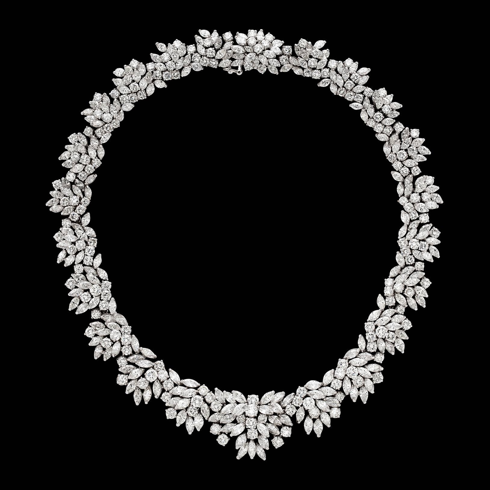 This exquisite platinum tapering cluster design necklace is set throughout with 407 marquise and round brilliant-cut diamonds, weighing in total an estimated 106.00 carats. The necklace measures 17 3/4 inches in length, and weighs 148.8 grams. A