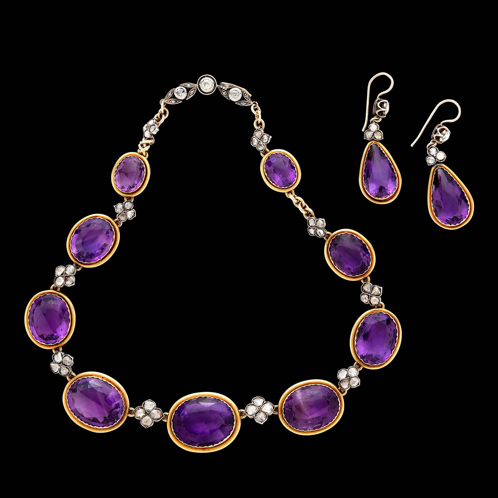 Add a piece of history to your collection with this vibrant Amethyst Necklace & Earring set from the late 1800's.  Stamped with French hallmark and in extraordinarily good condition, this 18 karat yellow gold and silver set highlights approximately