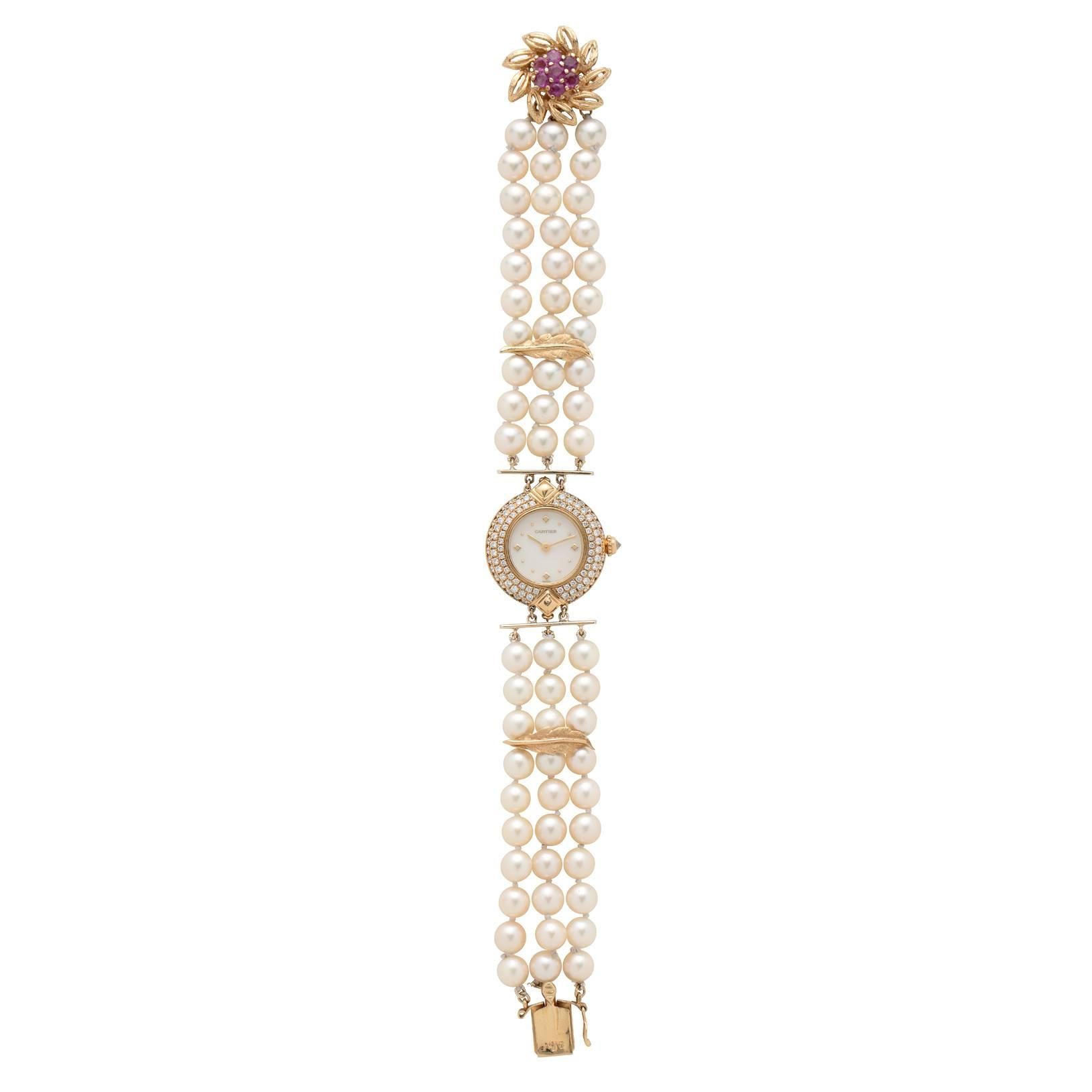 Make a statement in this exceptional Cartier Diamond Set Watch with Mother Of Pearl Face set on a client's own three strands of Pearls with Gold Leaf accents and a Ruby and Gold Floral Clasp. The rare Cartier watch face showcases 96 brilliant pave'
