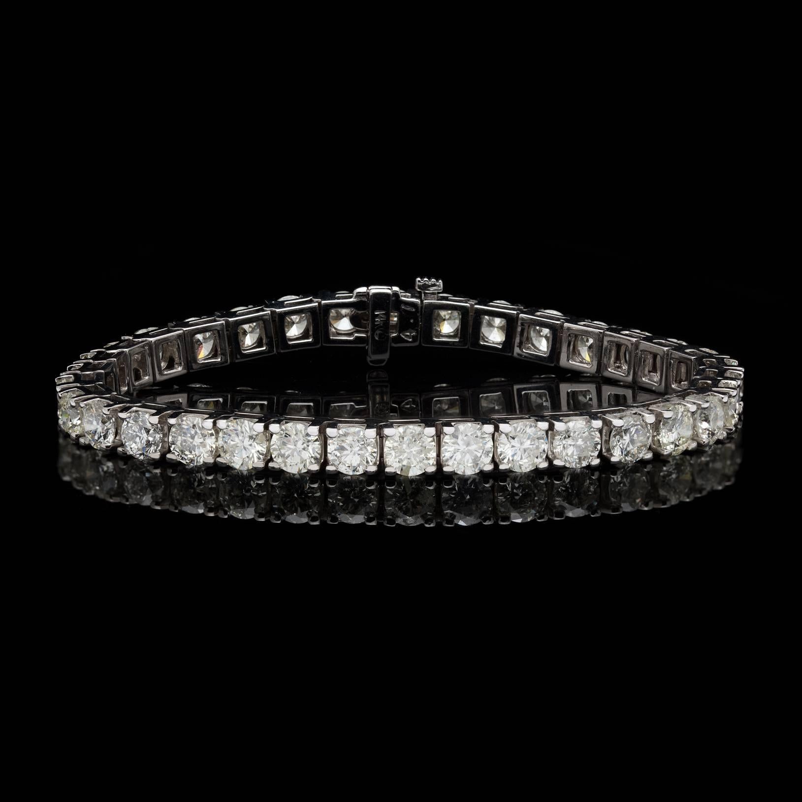 A must have accessory ever since Chris Evert stepped onto the court at the U.S. Open in 1987 dawning one of these beauties.  Featuring 34 Round Brilliant Cut Diamonds weighting a total of 13.70 carats, this 14 karat white gold stunner is sure to