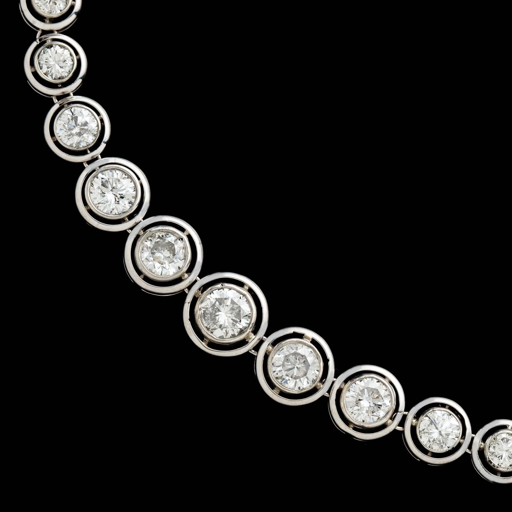 A lesson in historic beauty! This incredibly well preserved antique diamond necklace features 57 Old Mine Cut Diamonds for approximately 8.06 carats elegantly bezel set in 14 karat white gold and silver. At just over 17