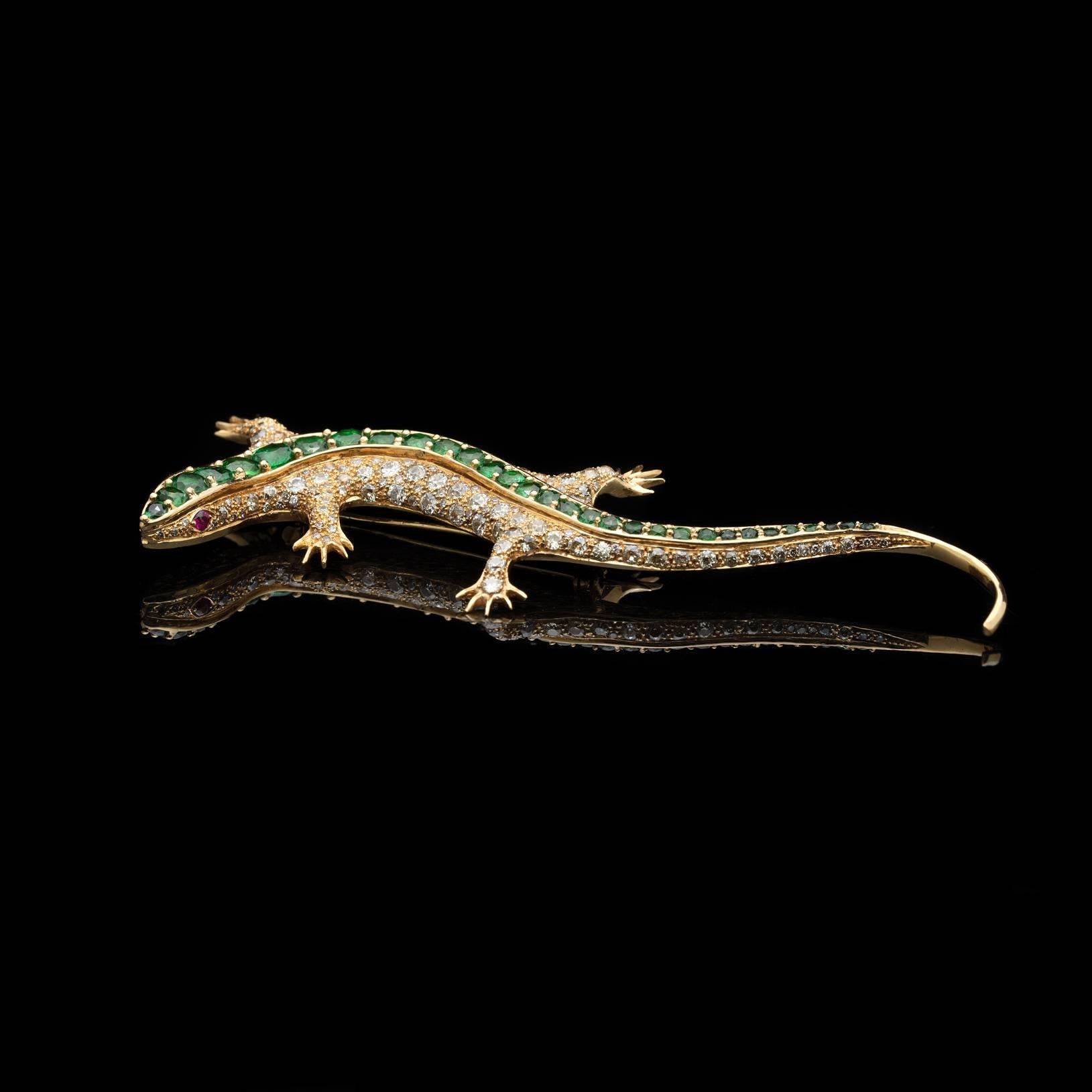 Fabulous 18k gold oversize salamander brooch, set with 188 European and single-cut diamonds which weigh in total approximately 4.00cts, the spine set with a line of oval and round bright and lively green tsavorite garnets weighing in total