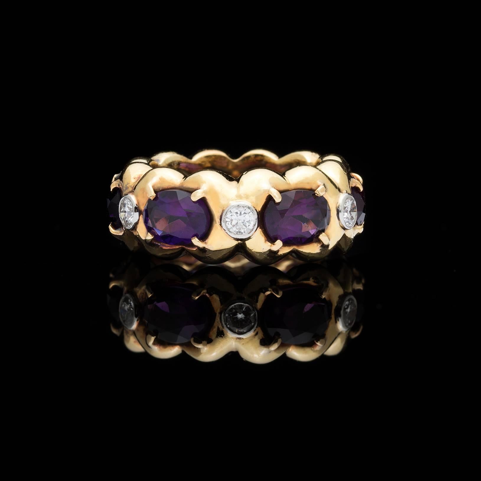 Verdura 18k gold band ring, with 6 horizontally-set oval-shaped deep purple ameythsts alternating with 6 platinum bezel-set round brilliant-cut diamonds, weighing an estimated total of 0.45ct. The ring weighs 14.9 grams, and fits a finger size of 5
