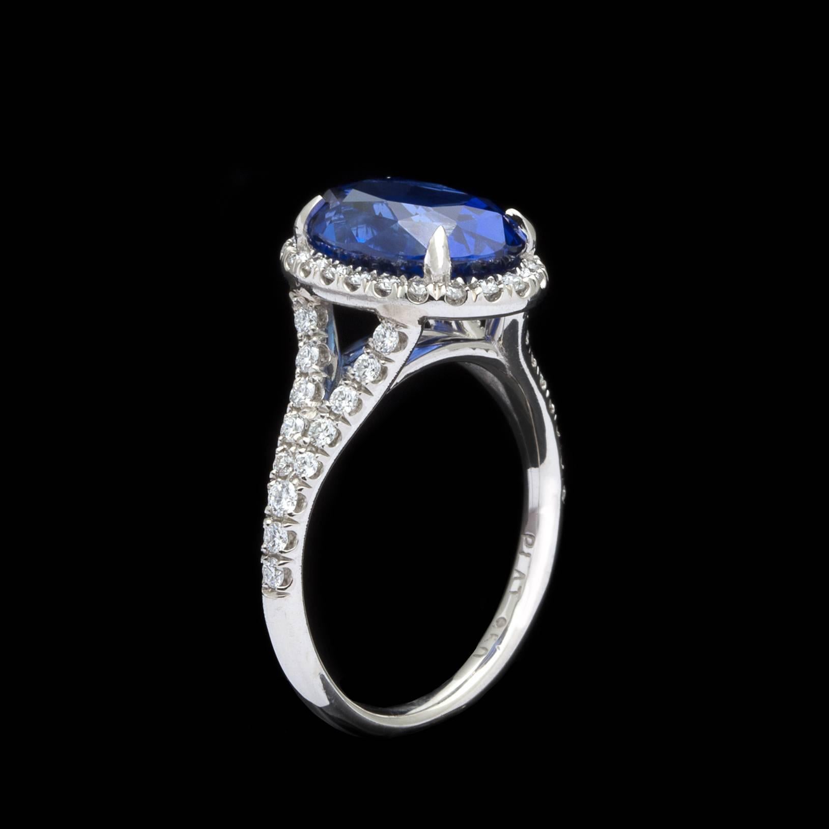 Oval Cut Unheated 5.08 Carat Blue Sapphire in Custom Platinum and Diamond Ring
