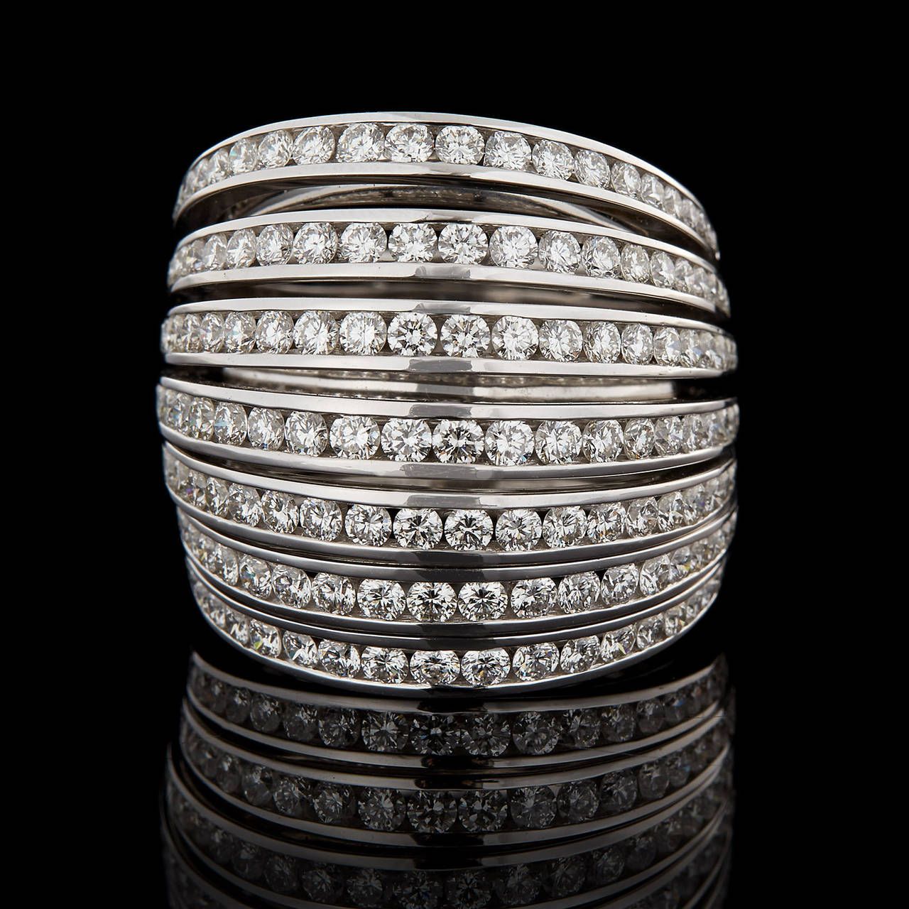 Mattia Cielo Uniquely Constructed 18Kt White Gold Seven Band Mobile Ring Features 2.21 Carats of G Color and VS Clarity Round Brilliant Cut Diamonds. The large statement ring moves with the wearer, displaying beautiful Italian craftsmanship and