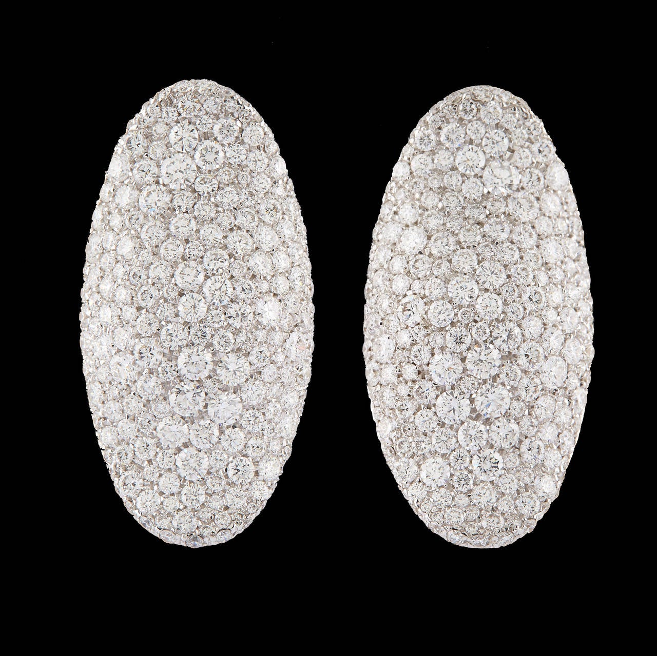 Palmiero Contemporary 18Kt White Gold Earrings Feature 6.23 Carat Total Weight of Pavé Set F Color and VVS1 Clarity Diamonds. These Italian made earrings measure 32mm long and 16mm wide. Together they weigh 13.2 grams.