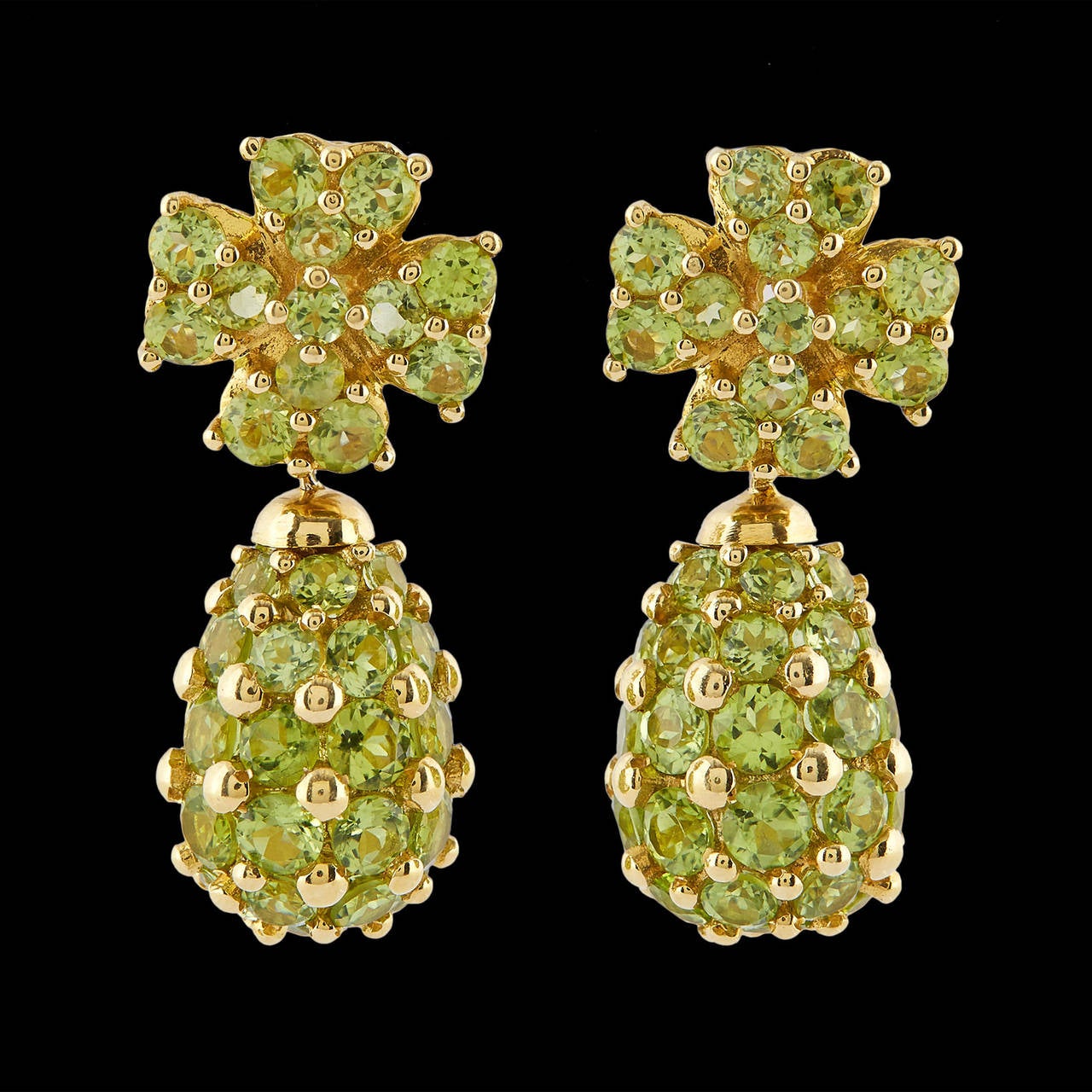 Salavetti Italian Made Convertible Earrings Set in 18Kt Yellow Gold with Varying Sized Round Cut Peridots. The earrings can be worn as 15.5 x 15.5mm clip back stud earrings or 37 x 15.5mm dangles. This glamorous pair weighs 28.0 grams.