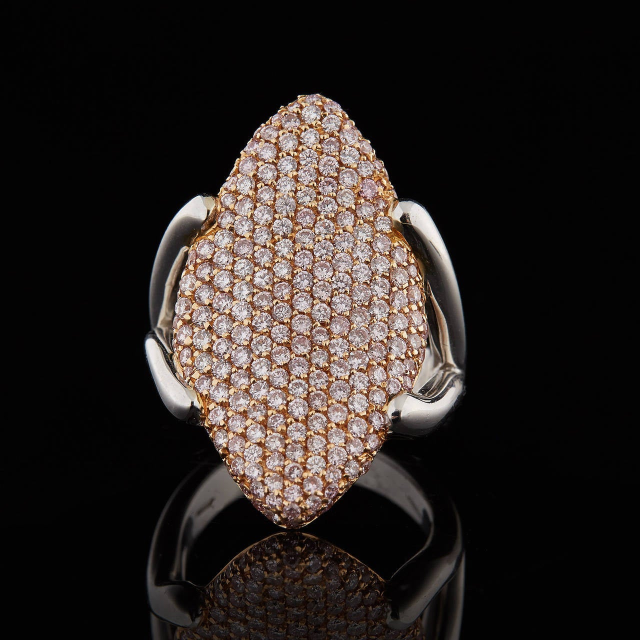 Luca Carati Navette Shape Cocktail Ring Features 2.08 Carats of Brilliant Pavé Set Pink Diamonds in 18Kt Gold. The weight of the ring is 19.5 grams with a ring size of 6.25. The navette top measures 1.25 x .75 inches. This Luca Carati ring is