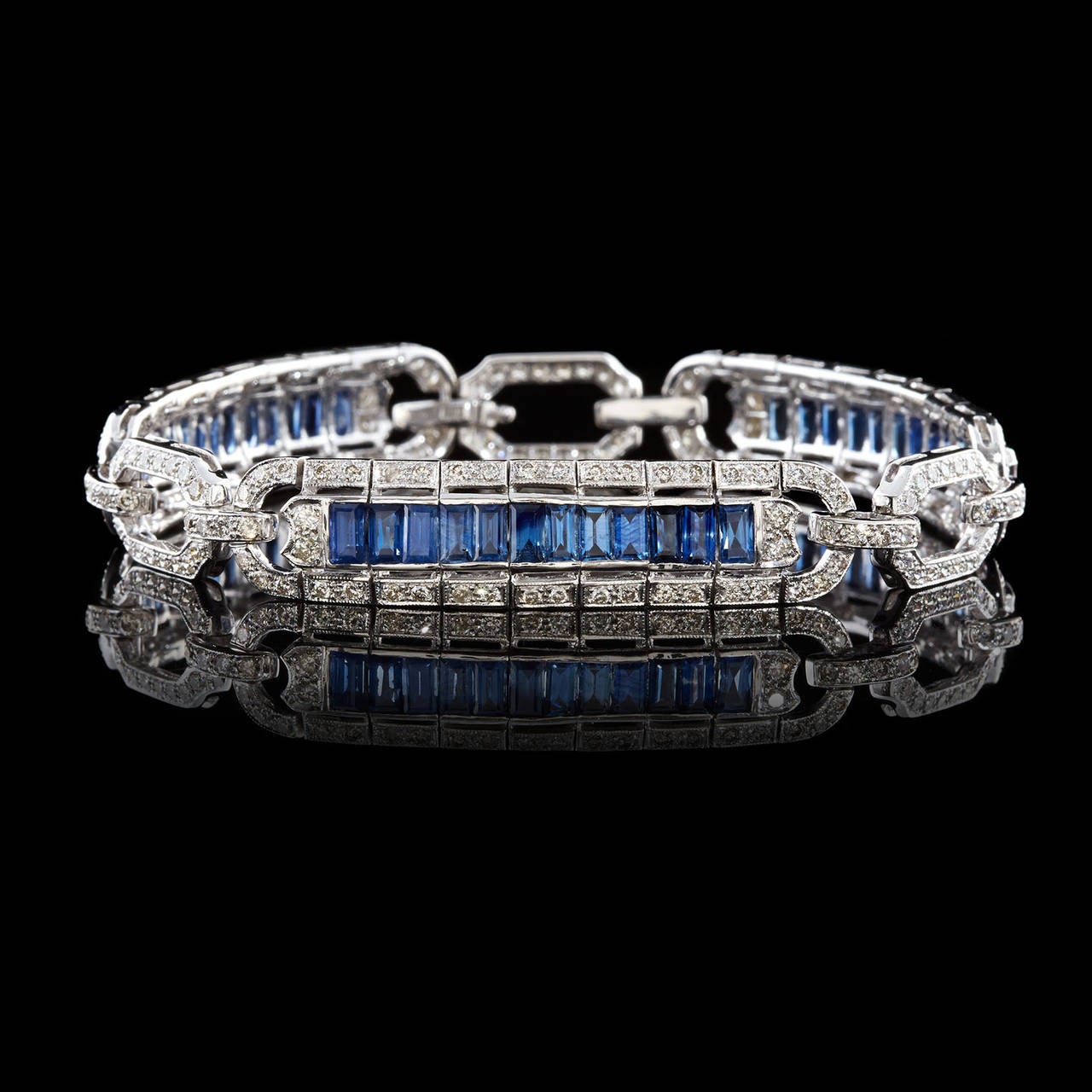 This Lovely Bracelet Features Round Brilliant Cut Diamonds and Rectangle Cut Sapphires Set in an Open Link 18Kt White Gold Design with Milgrain Detailing on the Metal. The 217 round brilliant cut diamonds total approximately 2.65 carats. The