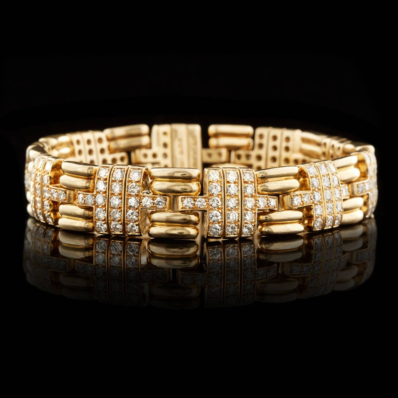 Bulgari Diamond Link Bracelet set in 18Kt Yellow Gold. This bracelet is designed with 190 round brilliant cut F-G color VS quality diamonds totaling approximately 5.70 carats. The bracelet measures 11mm wide and 6.75 inches long. Total item weight