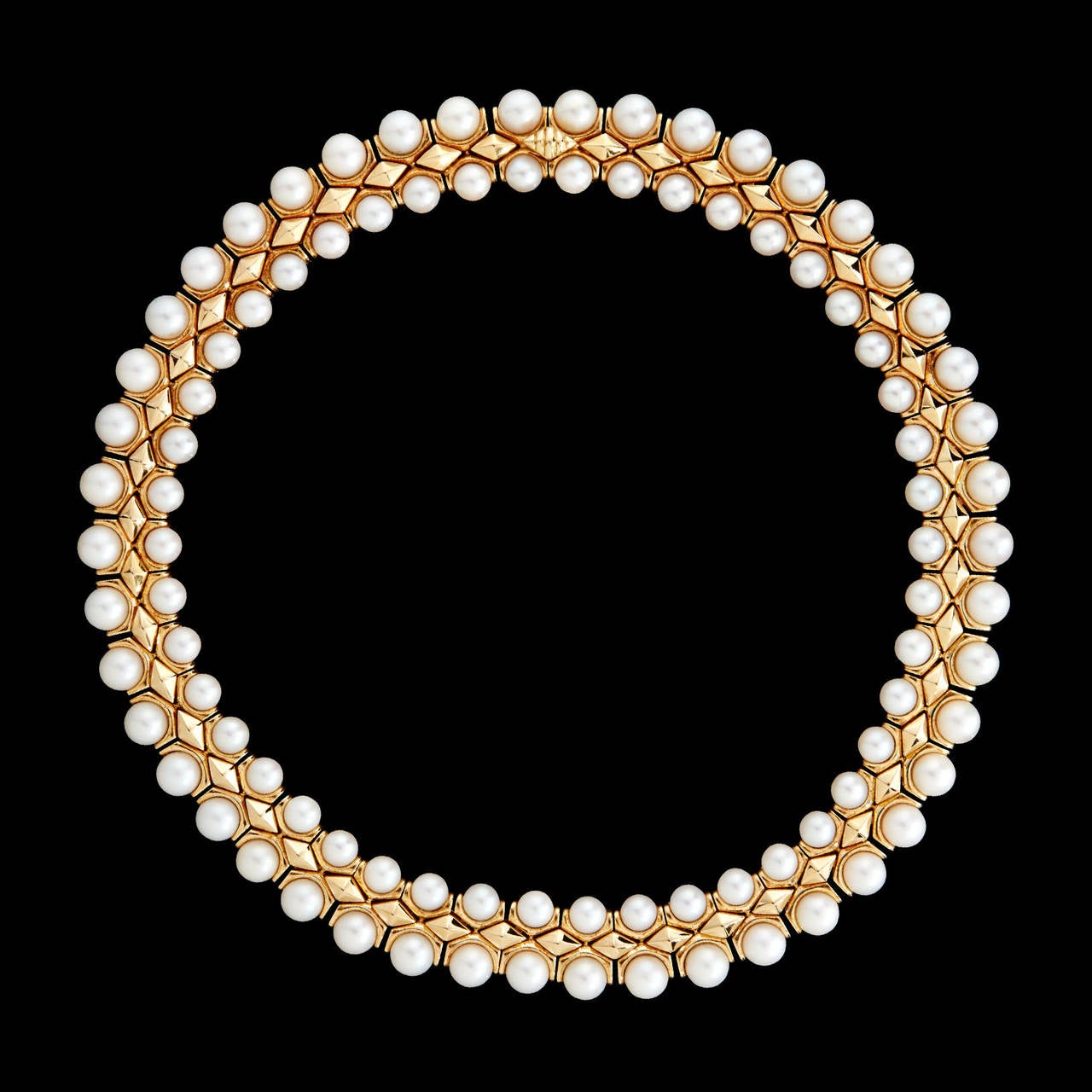 This Fantastic Bulgari Choker Features 92 Cultured Pearls of 7mm & 6mm Diameter in a Unique 18Kt Yellow Gold Setting. The necklace measures 16 inches long and 16mm wide, weighing 152.9 grams.