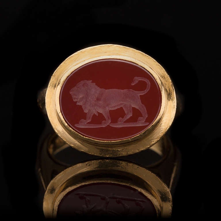 Mid Century 22Kt Yellow Gold Ring features an Oval Carnelian Intaglio Lion that measures 13 x 16mm.  Total weight of ring is 18.7 grams and is a size 6.75.