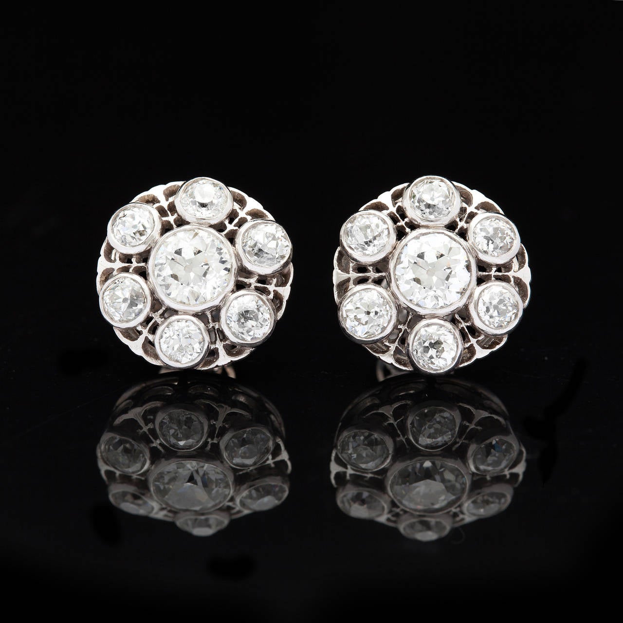 3.30 carats of Old European Cut Diamonds set in 18Kt White Gold from the Victorian Period. The earring measures 14.0 mm in diameter and weighs 7.6 grams total.