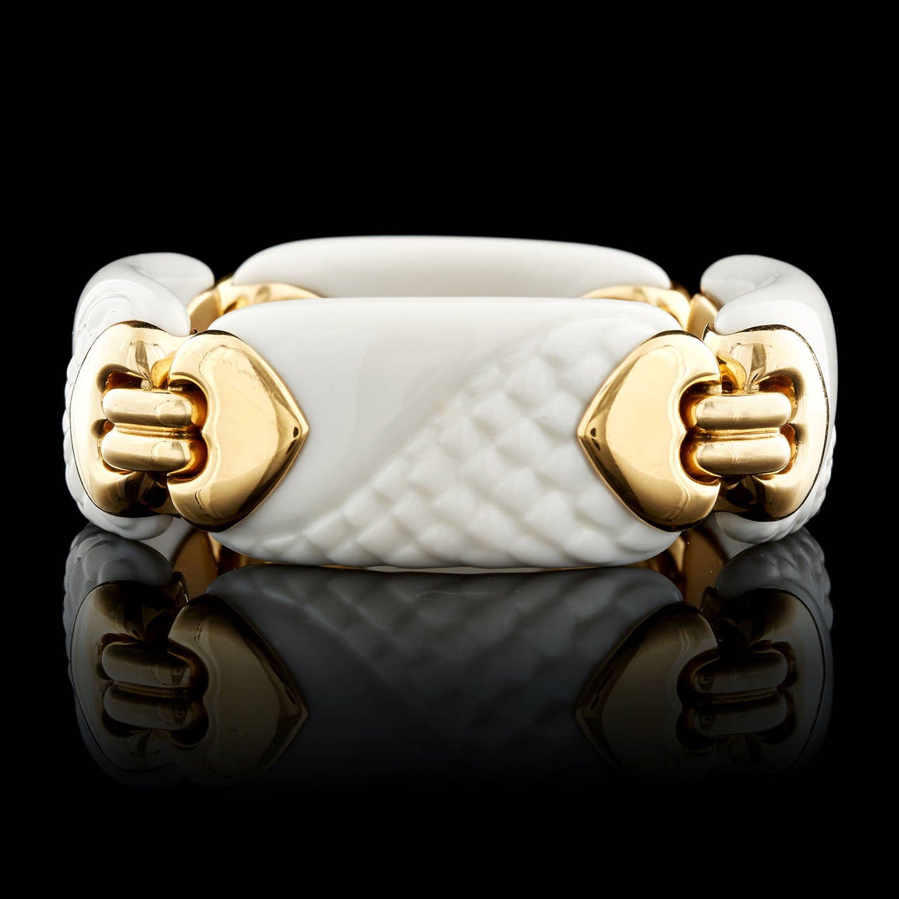 Bulgari Porcelain & 18Kt Yellow Gold Link Bracelet from the Chandra Collection. This bracelet measures 8 inches long and about 1 inch wide. Total weight is 98.1 grams.
