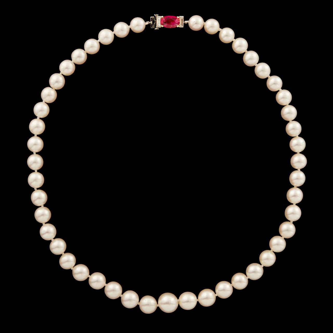 Vintage Van Cleef & Arpels Akoya Pearl Necklace Featuring a GIA Graded Oval Cut Natural Ruby Clasp with No Indications of Heating.  The approximately 1.45 carat ruby is set in 18kt yellow gold prongs and flanked by two fine quality step cut diamonds