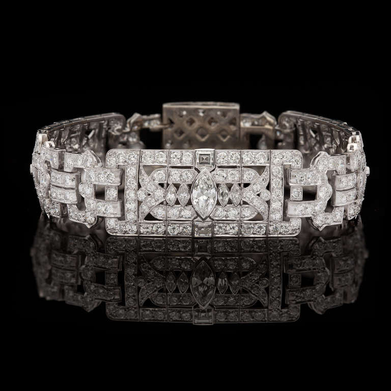 Restored Art Deco 16.26ct total weight Diamond Bracelet Features 4 Marquise Cut Diamonds, for approximately 2.50cts, along with 330 Old European and Square Step Cut Diamonds, for another 13.76cts. The diamonds are set in Platinum with an 18Kt White