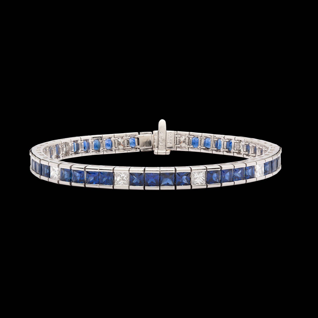 Platinum Line Bracelet features 40 Blue Sapphires totaling 9.68 carats with 10 Princess Cut Diamonds totaling 2.27 carats. The bracelet is 6.75 inches long, 5mm wide and weighs 32.1 grams total.