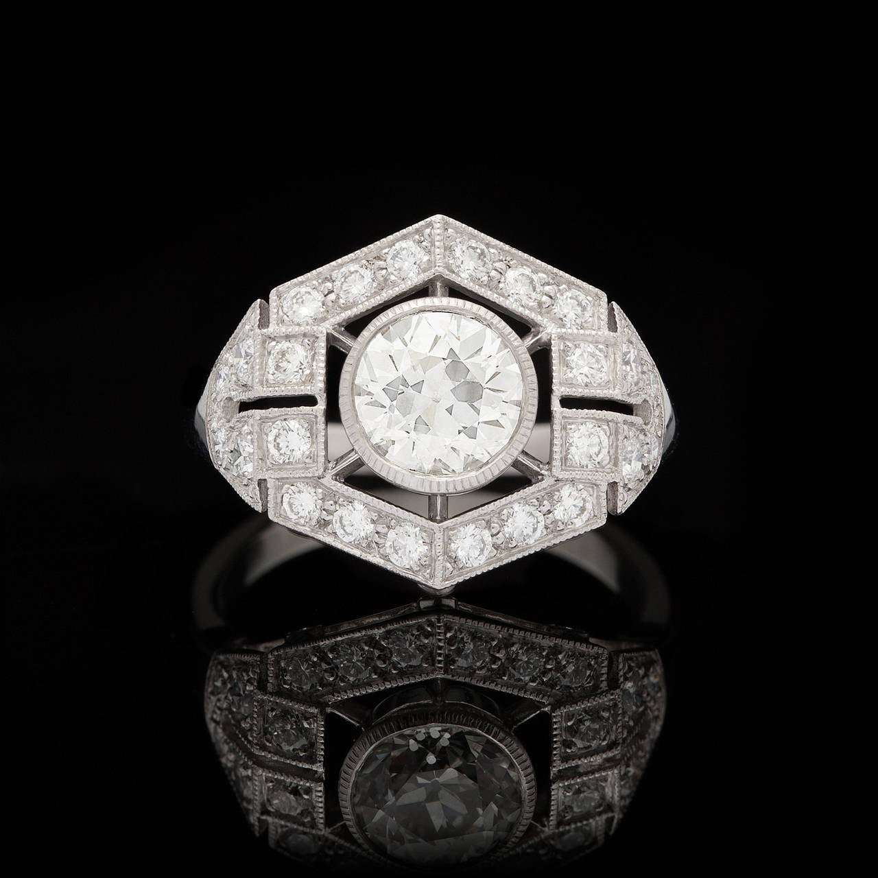 Sebastien Barier Ring Featuring One J Color and VS2 Clarity 1.33 Carat Old European Brilliant Cut Diamond in a Geometric Deco Style Setting, Complete with GIA Grading Report for the Center Stone. The design is accented with an additional 0.75-ctw of