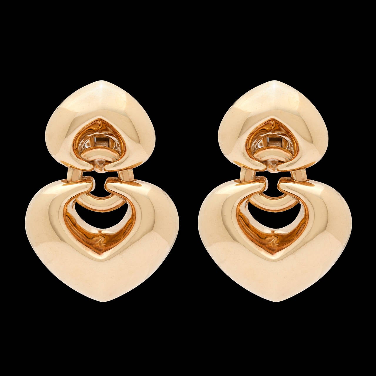 Bulgari 18Kt Yellow Gold Double Heart Earrings, circa 1980s, with Posts & Omega Clips. The earrings measure approximately 1.25 inches long and .75 inches wide. Total weight of the pair is 19.4 grams.