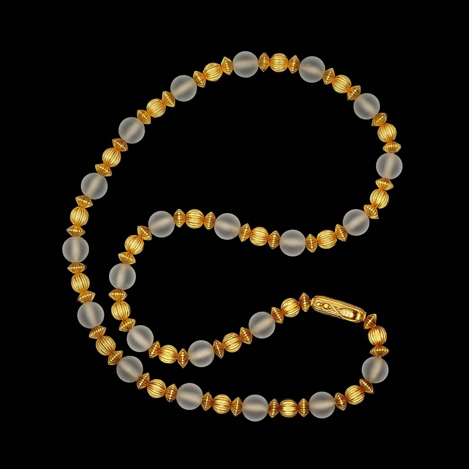 Lalaounis Alternating Rock Crystal Quartz and 18Kt Yellow Gold Textured Beads strung on a yellow gold Braided chain. The size of the quartz crystals is 9.0mm. Length is 20 inches and weighs 52.1 grams total.