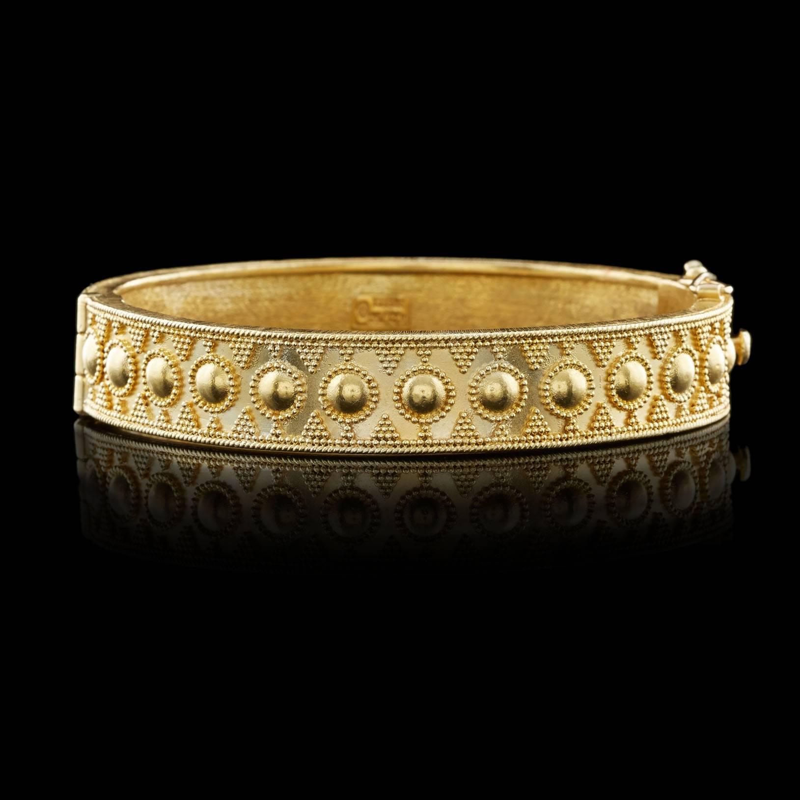 Lalaounis Beautifully Crafted 18Kt Yellow Gold Bangle, From the Greek Designer. The bracelet measures 7 inches around and 10.5mm wide. This piece weighs 35.9 grams.